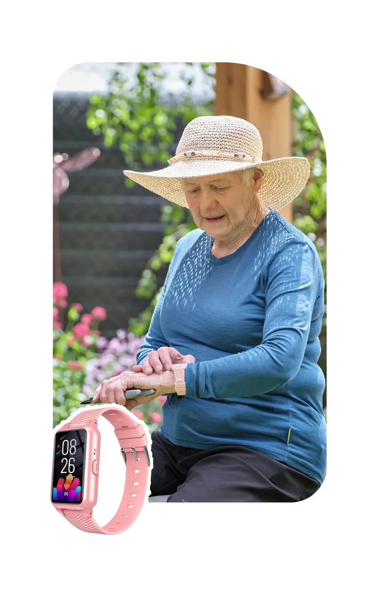 A old lady looking at her Fall Detection watch
