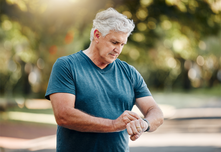 elderly man wearing a personal alarm watch